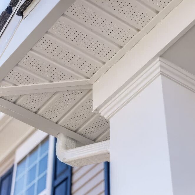 underneath view of soffit of two story vinyl home.